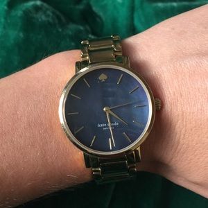 Gold Kate spade watch with abalone shell face.